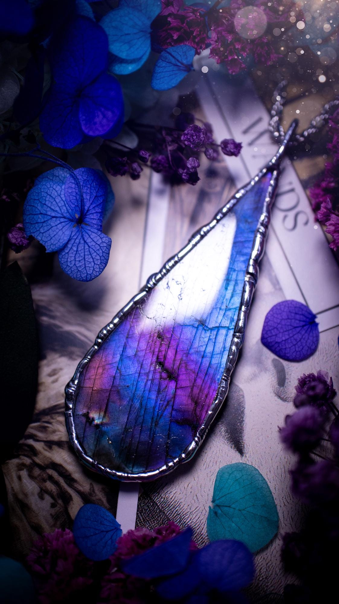 Beautiful and bold, soft soldered, large and very unique Labradorite pendant necklace. This pendant necklace has been handmade using the soft solder method, using lead free solder that contains silver and polished to a high lustre. Featuring a large, very pretty statement Labradorite crystal that is full of beautiful purples, pinks, and blues, with different flashes from different angles. This piece would but suitable for anyone who loves jewellery, crystals, and a gothic aesthetic.