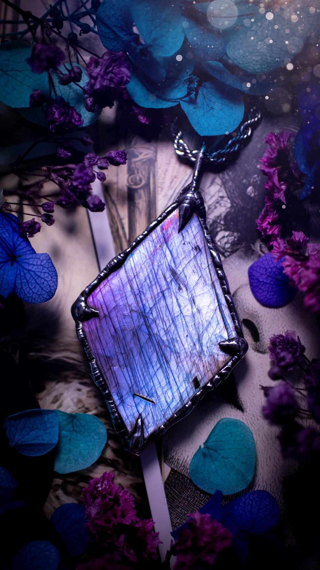 One of a kind, purple pink and blue, soft soldered, Labradorite crystal pendant necklace. This pendant has been made with love and care, handcrafted using the tiffany technique, also known as soft solder method. The crystal has a bezel of solder that contains various metals including silver and is hypoallergenic. Featuring a stunning, natural and unique coloured Labradorite crystal. This jewellery piece is ideal for gifting and for anyone who loves crystals and jewellery with a gothic vibe.