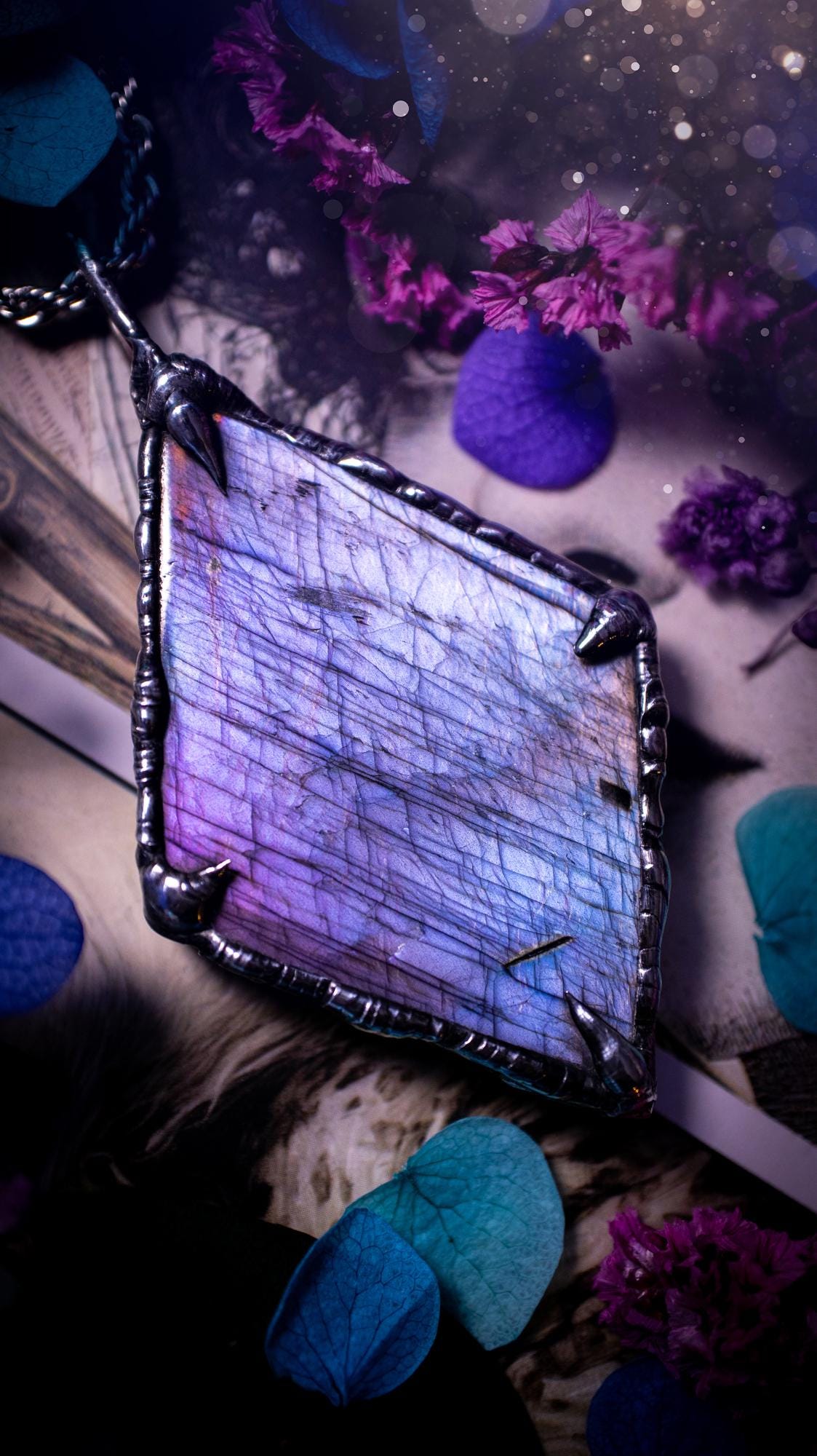 One of a kind, purple pink and blue, soft soldered, Labradorite crystal pendant necklace. This pendant has been made with love and care, handcrafted using the tiffany technique, also known as soft solder method. The crystal has a bezel of solder that contains various metals including silver and is hypoallergenic. Featuring a stunning, natural and unique coloured Labradorite crystal. This jewellery piece is ideal for gifting and for anyone who loves crystals and jewellery with a gothic vibe.