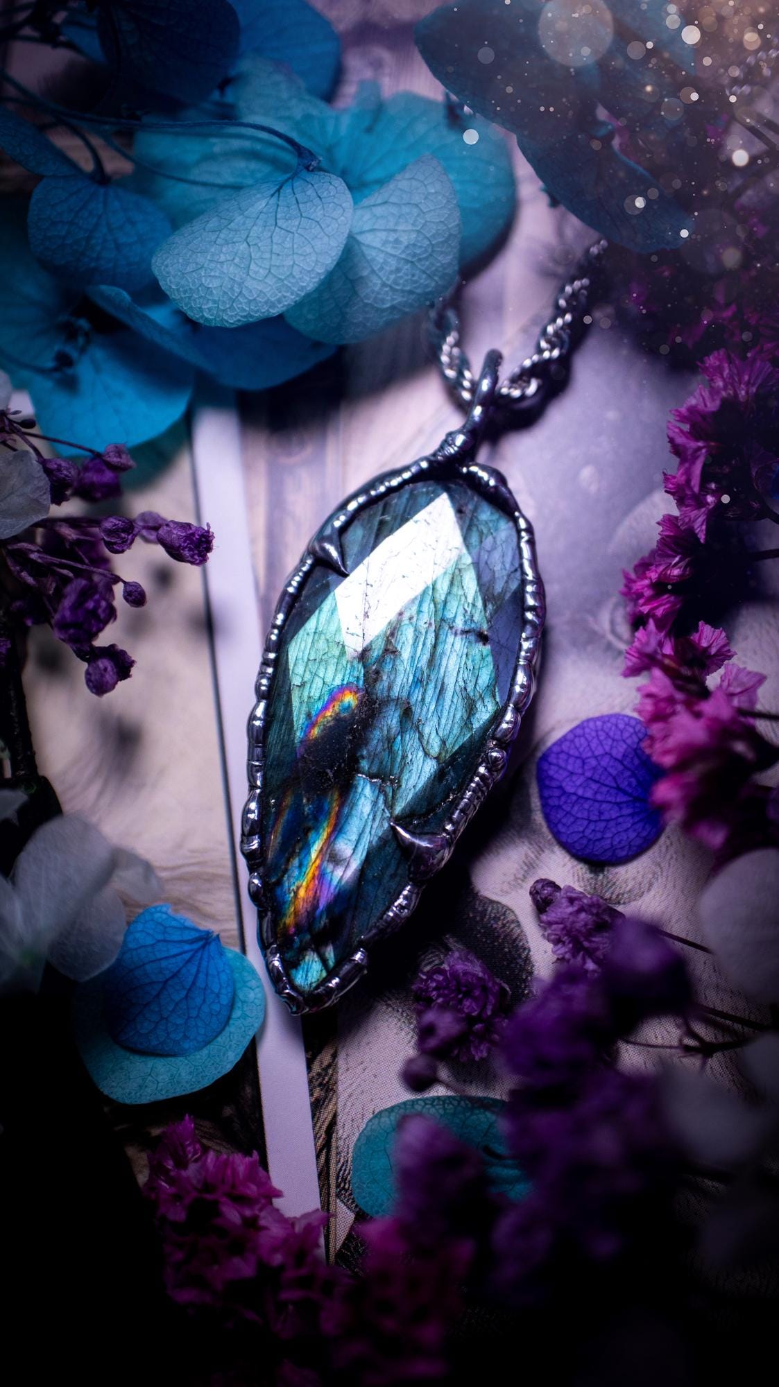 One of a kind, teal green and rainbow, soft soldered, Labradorite crystal pendant necklace. This pendant has been made with love and care, handcrafted using the tiffany technique, also known as soft solder method. The crystal has a bezel of solder that contains various metals including silver and is hypoallergenic. Featuring a stunning, natural and unique coloured Labradorite crystal. This jewellery piece is ideal for gifting and for anyone who loves crystals and jewellery with a gothic vibe.