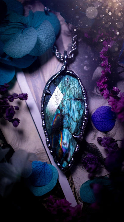 One of a kind, teal green and rainbow, soft soldered, Labradorite crystal pendant necklace. This pendant has been made with love and care, handcrafted using the tiffany technique, also known as soft solder method. The crystal has a bezel of solder that contains various metals including silver and is hypoallergenic. Featuring a stunning, natural and unique coloured Labradorite crystal. This jewellery piece is ideal for gifting and for anyone who loves crystals and jewellery with a gothic vibe.