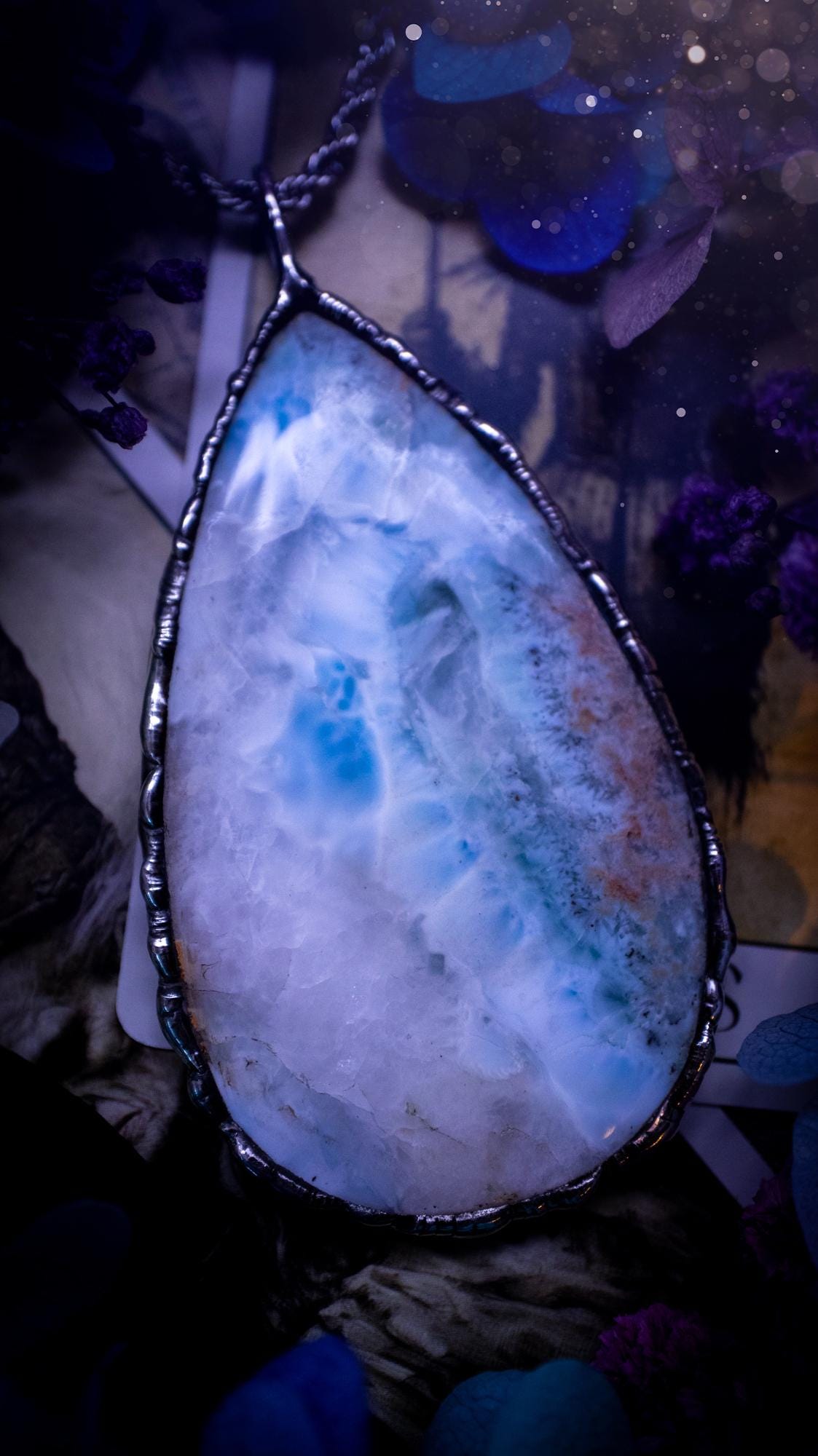 One of a kind, large, soft soldered, Larimar crystal pendant necklace. This pendant has been made with love and care, handcrafted using the tiffany technique, also known as soft solder method. The crystal has a bezel of solder that contains various metals including silver and is hypoallergenic. Featuring a stunning, natural and unique coloured Larimar crystal. This jewellery piece is ideal for gifting and for anyone who loves crystals and jewellery with a gothic vibe.