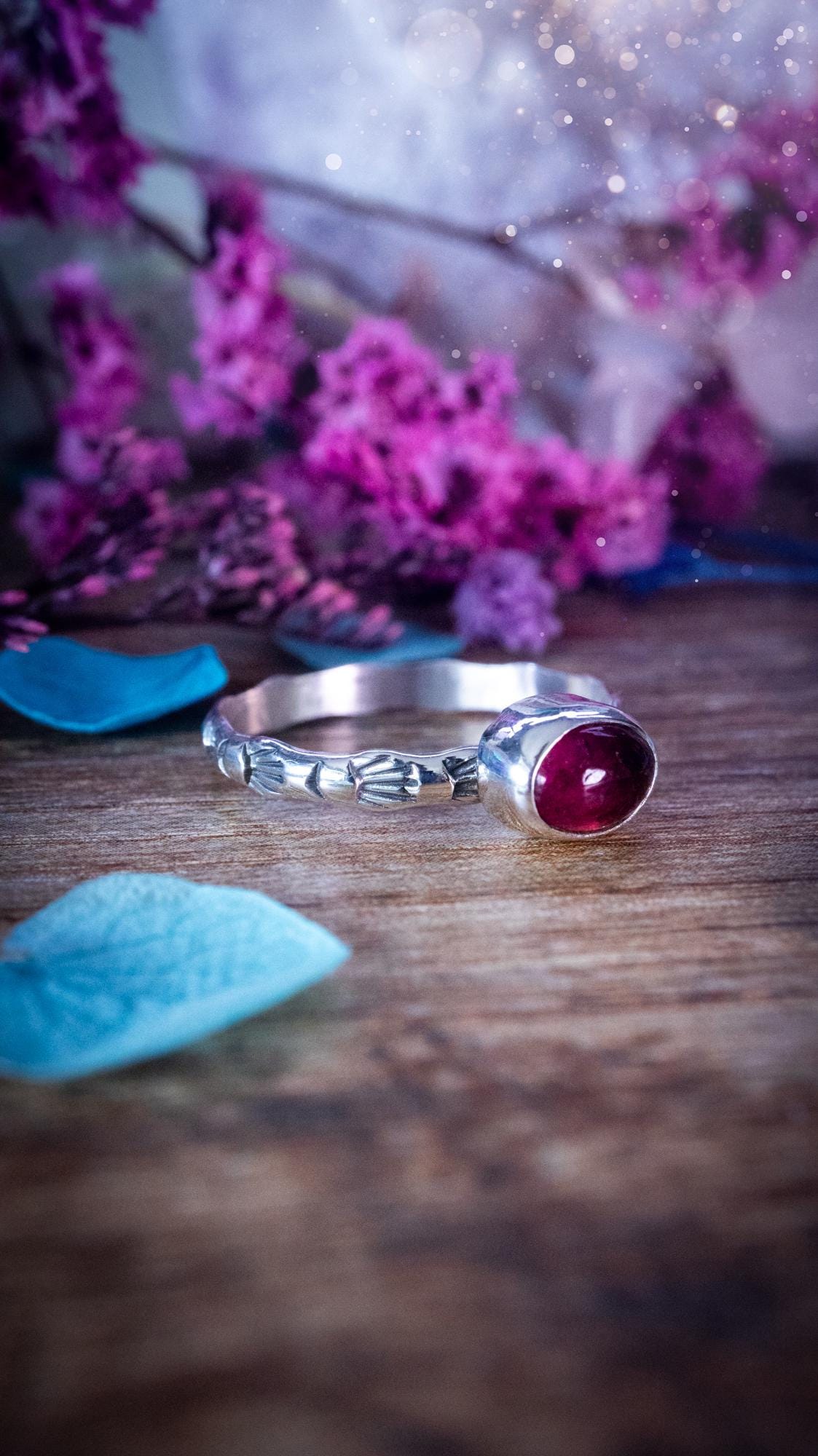 Dainty pink tourmaline stacker ring with a small gemmy natural pink tourmaline gemstone set on a patterned sterling silver band. Handmade with care, this delicate stacking ring features a subtle textured design, perfect for everyday wear or layering with other rings. Feminine and elegant, this minimalist gemstone ring makes a beautiful October birthstone gift or a meaningful addition to any jewellery collection, ideal for lovers of dainty, handmade silver jewellery.