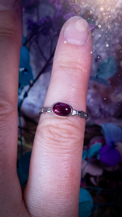 Dainty pink tourmaline stacker ring with a small gemmy natural pink tourmaline gemstone set on a patterned sterling silver band. Handmade with care, this delicate stacking ring features a subtle textured design, perfect for everyday wear or layering with other rings. Feminine and elegant, this minimalist gemstone ring makes a beautiful October birthstone gift or a meaningful addition to any jewellery collection, ideal for lovers of dainty, handmade silver jewellery.