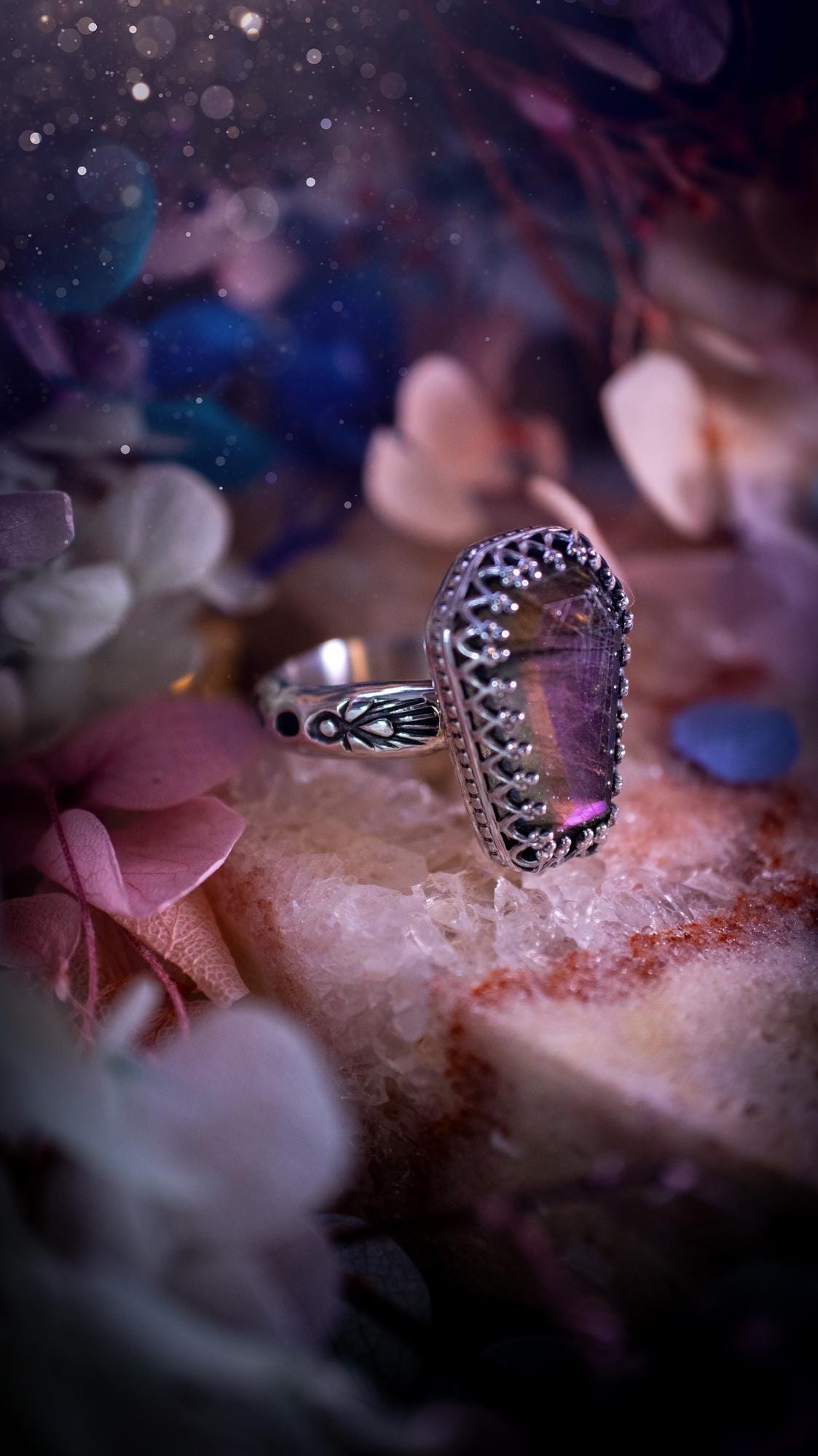 Beautiful and completely handmade, purple labradorite coffin, gothic style, mini statement stacker ring. This ring has been handcrafted using a mix of fine and sterling silver. Featuring a beautiful, purple labradorite gemstone. The crystal is step cut for a sparkle and is full of flash! Around the labradorite is a gothic gallery wire bezel for extra gothic vibes. The ring shank has a one of a kind stamped pattern. Ideal for birthdays and special occasions. Gothic and witchy jewellery.