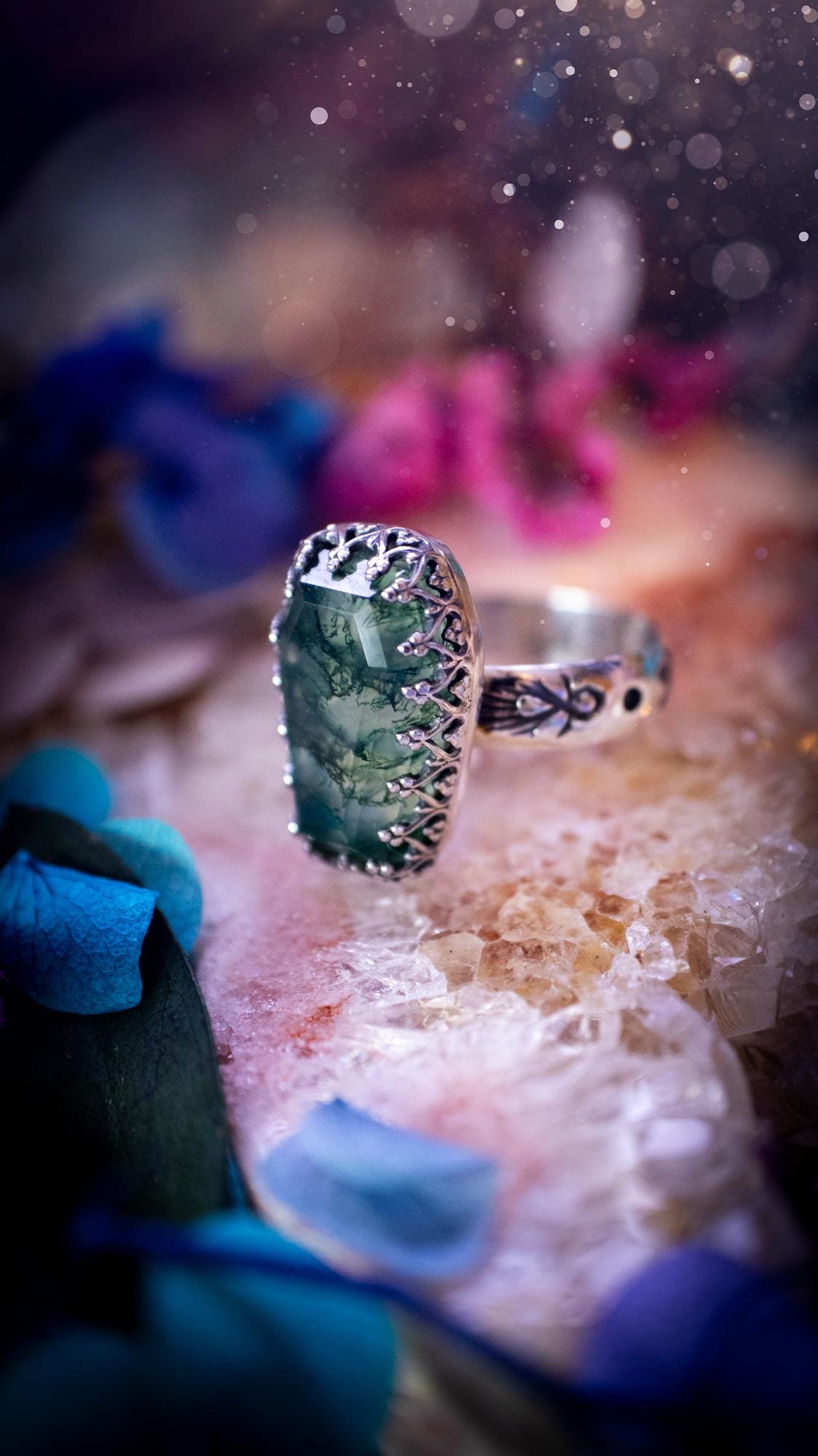 Beautiful and completely handmade, moss agate coffin, gothic style, mini statement stacker ring. This ring has been handcrafted using a mix of fine and sterling silver. Featuring a beautiful, very mossy, moss agate gemstone. The crystal is step cut for a sparkle and is full of flash! Around the moss agate is a gothic gallery wire bezel for extra gothic vibes. The ring shank has a one of a kind stamped pattern. Ideal for birthdays and special occasions. Gothic and witchy jewellery.