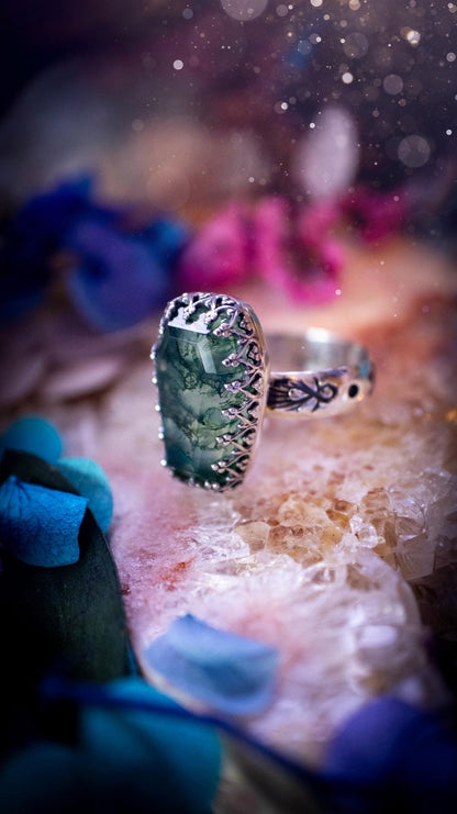 Beautiful and completely handmade, moss agate coffin, gothic style, mini statement stacker ring. This ring has been handcrafted using a mix of fine and sterling silver. Featuring a beautiful, very mossy, moss agate gemstone. The crystal is step cut for a sparkle and is full of flash! Around the moss agate is a gothic gallery wire bezel for extra gothic vibes. The ring shank has a one of a kind stamped pattern. Ideal for birthdays and special occasions. Gothic and witchy jewellery.