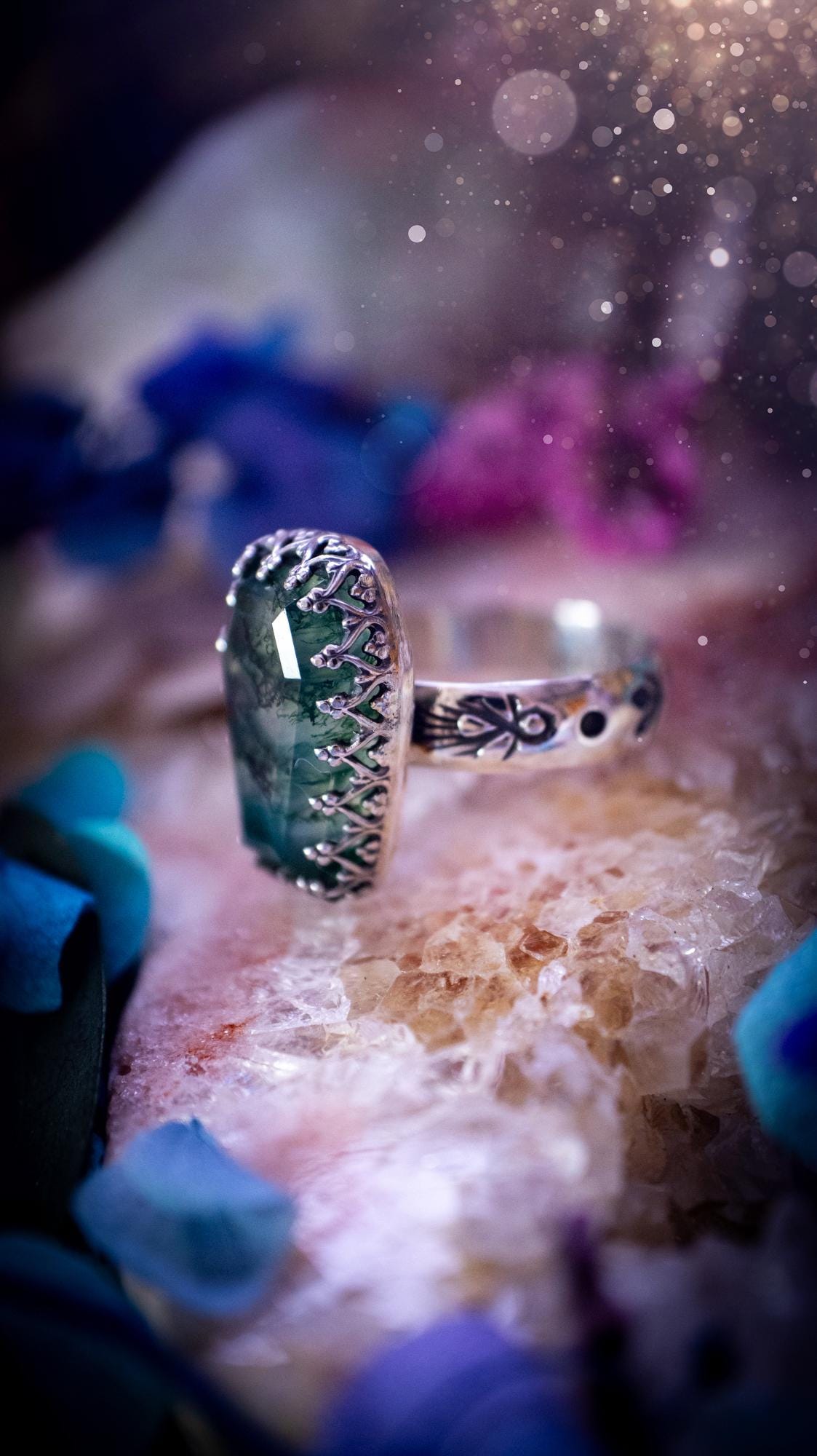 Beautiful and completely handmade, moss agate coffin, gothic style, mini statement stacker ring. This ring has been handcrafted using a mix of fine and sterling silver. Featuring a beautiful, very mossy, moss agate gemstone. The crystal is step cut for a sparkle and is full of flash! Around the moss agate is a gothic gallery wire bezel for extra gothic vibes. The ring shank has a one of a kind stamped pattern. Ideal for birthdays and special occasions. Gothic and witchy jewellery.