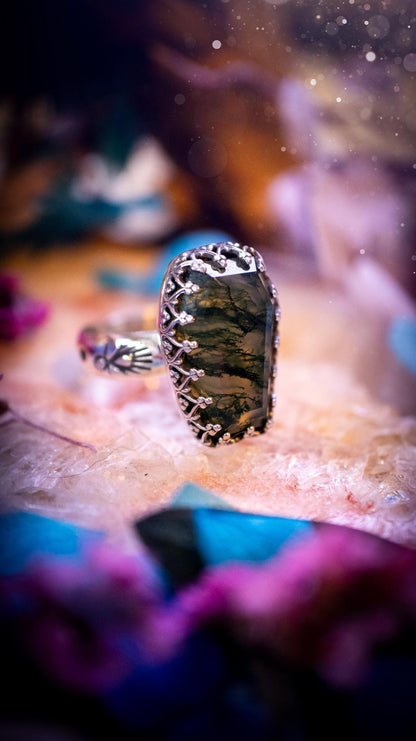 Beautiful and completely handmade, moss agate coffin, gothic style, mini statement stacker ring. This ring has been handcrafted using a mix of fine and sterling silver. Featuring a beautiful, very mossy, moss agate gemstone. The crystal is step cut for a sparkle and is full of flash! Around the moss agate is a gothic gallery wire bezel for extra gothic vibes. The ring shank has a one of a kind stamped pattern. Ideal for birthdays and special occasions. Gothic and witchy jewellery.