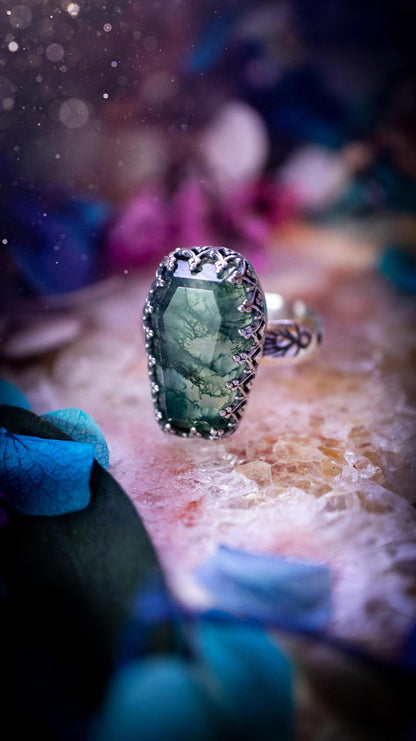 Beautiful and completely handmade, moss agate coffin, gothic style, mini statement stacker ring. This ring has been handcrafted using a mix of fine and sterling silver. Featuring a beautiful, very mossy, moss agate gemstone. The crystal is step cut for a sparkle and is full of flash! Around the moss agate is a gothic gallery wire bezel for extra gothic vibes. The ring shank has a one of a kind stamped pattern. Ideal for birthdays and special occasions. Gothic and witchy jewellery.