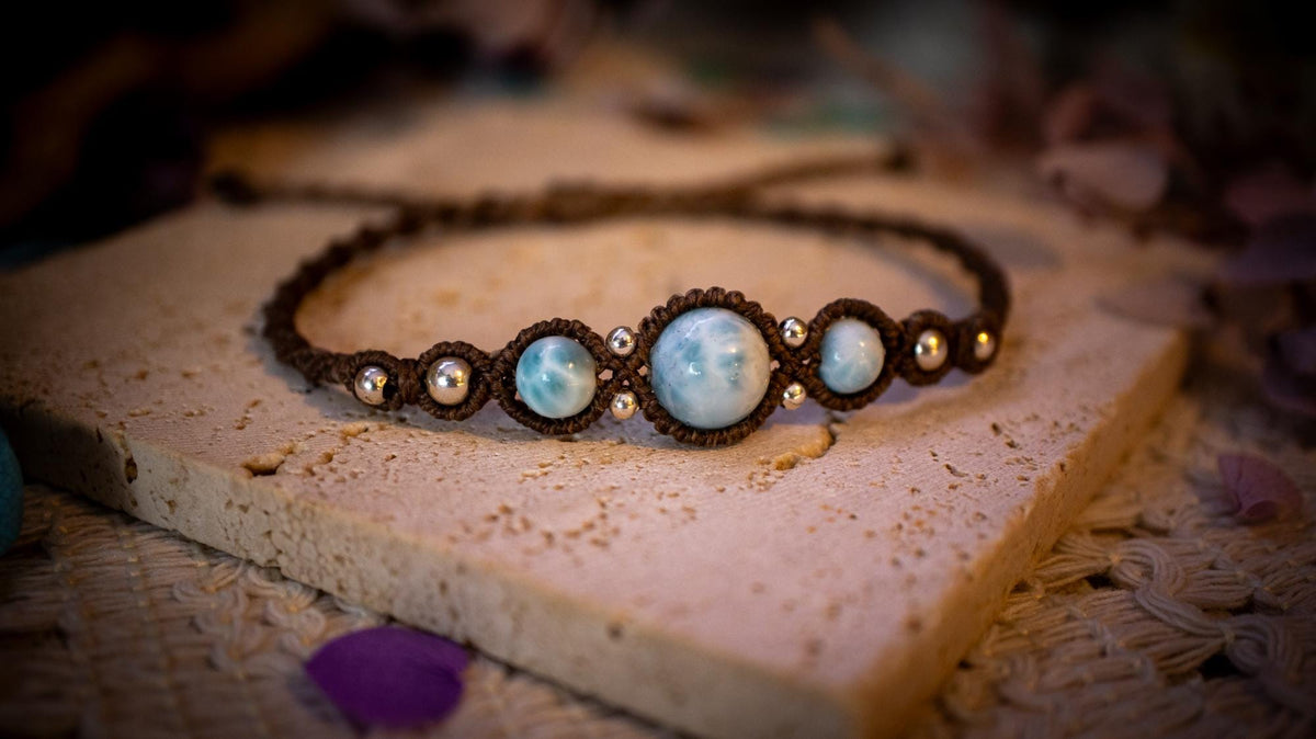 Beautiful and handmade, larimar with sterling silver beads, macrame bracelet. This bracelet has been handmade using high quality Linhasita wax cord which is a dark brown colour. Featuring stunning, high quality Larimar crystal beads that are full of natural pattern. There are also 925 sterling silver beads within the macrame pattern. A lovely little gift for a close one, or a little treat for yourself! Ideal for birthdays, anniversaries, and special occasions. Hippy jewellery for the soul.