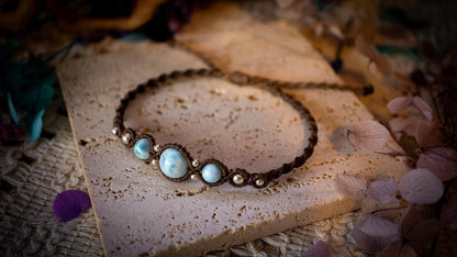 Beautiful and handmade, larimar with sterling silver beads, macrame bracelet. This bracelet has been handmade using high quality Linhasita wax cord which is a dark brown colour. Featuring stunning, high quality Larimar crystal beads that are full of natural pattern. There are also 925 sterling silver beads within the macrame pattern. A lovely little gift for a close one, or a little treat for yourself! Ideal for birthdays, anniversaries, and special occasions. Hippy jewellery for the soul.