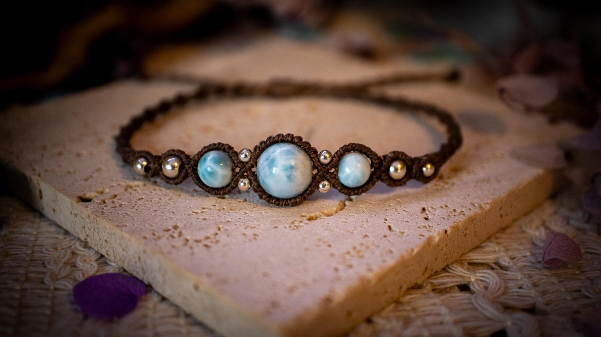 Beautiful and handmade, larimar with sterling silver beads, macrame bracelet. This bracelet has been handmade using high quality Linhasita wax cord which is a dark brown colour. Featuring stunning, high quality Larimar crystal beads that are full of natural pattern. There are also 925 sterling silver beads within the macrame pattern. A lovely little gift for a close one, or a little treat for yourself! Ideal for birthdays, anniversaries, and special occasions. Hippy jewellery for the soul.