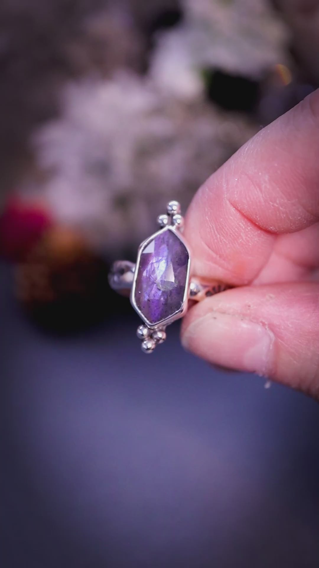 Beautiful, gothic and handmade, purple labradorite crystal statement ring. This ring has been handmade from recycled sterling silver featuring the most beautiful rose cut labradorite that is full of sparkle and purple flash. Mounted on a stamped ring shank. Unique jewellery gifts.