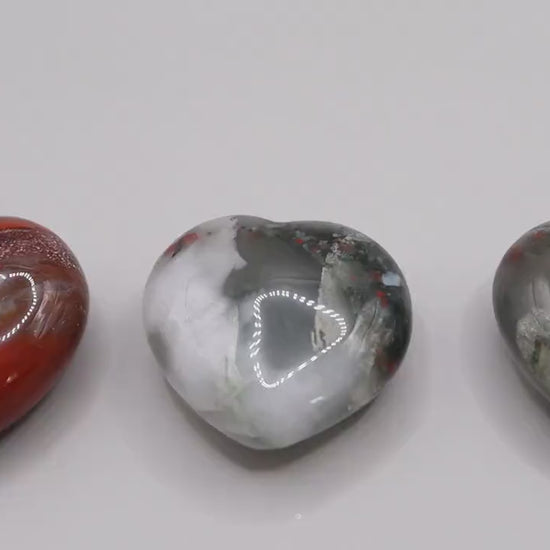 Beautiful, African Bloodstone puffy mini hearts. Beautiful red speckles, and gorgeous patterns. Approximately: Height 3 cm, Width 3 cm, Depth 1.5 cm  Average weight: 20 grams each. Ideal as pocket crystal and little gifts for crystal lovers.