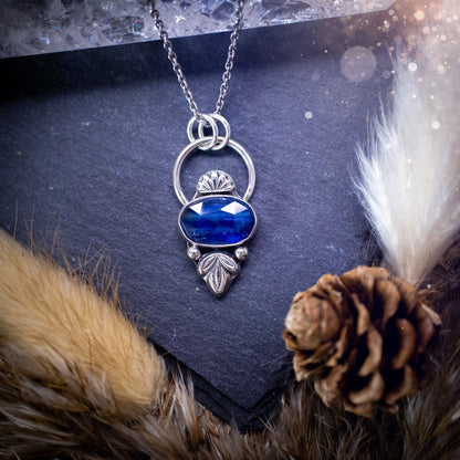 Beautiful, rose cut Blue kyanite sterling silver pendant. This little pendant has been handmade with love and care and has the most stunning colours within the gemstone. Accompanied by silver components including a free chain. Ideal crystal gift.