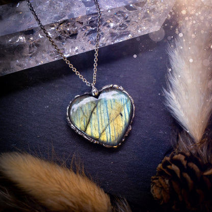 Beautiful autumn greens and yellow, labradorite heart, soft soldered pendant. This beautiful heart pendant is sure to turn heads with its beautiful array of colours and flash. Ideal gift for any crystal lover