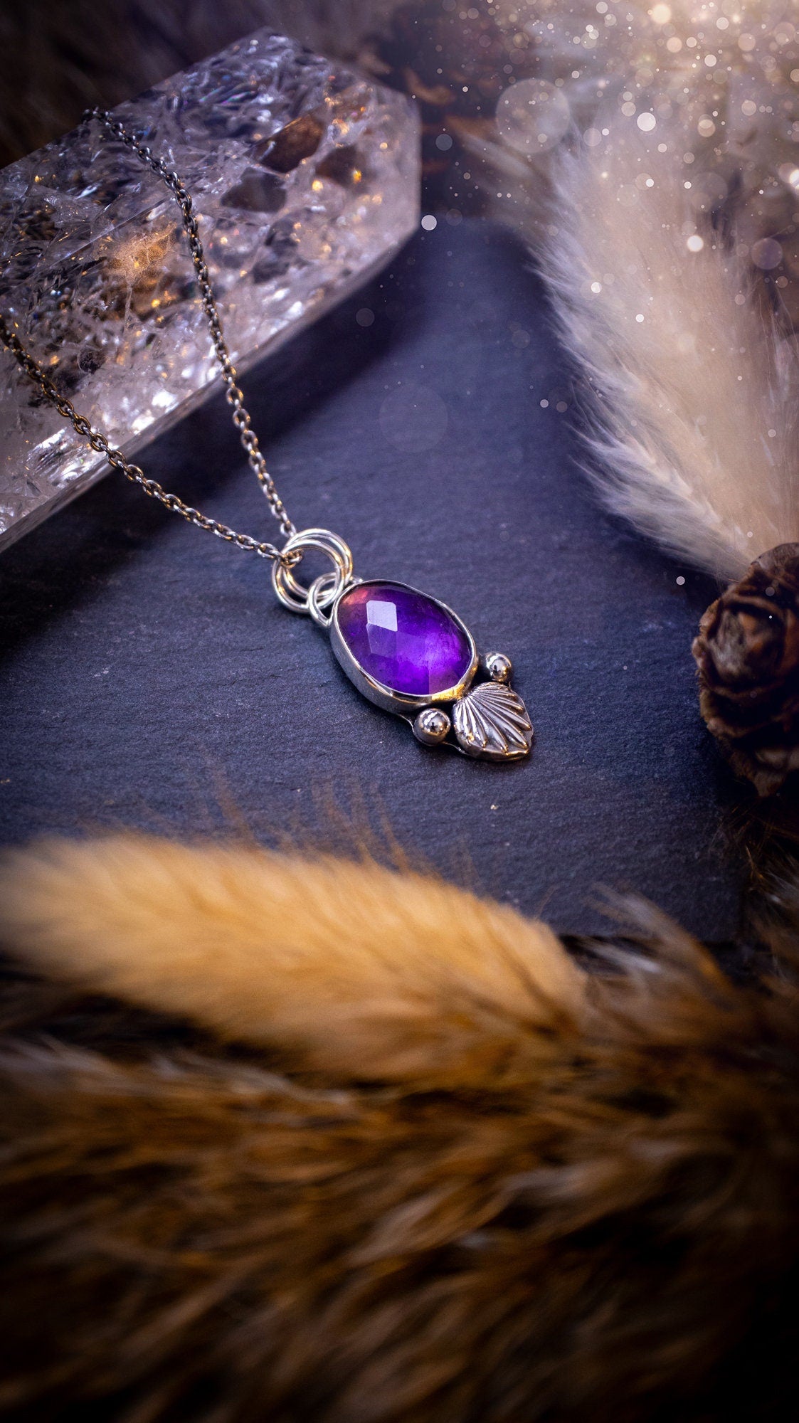 Beautiful, rose cut Amethyst sterling silver pendant. This little pendant has been handmade with love and care and has the most stunning purples within the gemstone. Accompanied by silver components including a free chain. Ideal crystal gift.