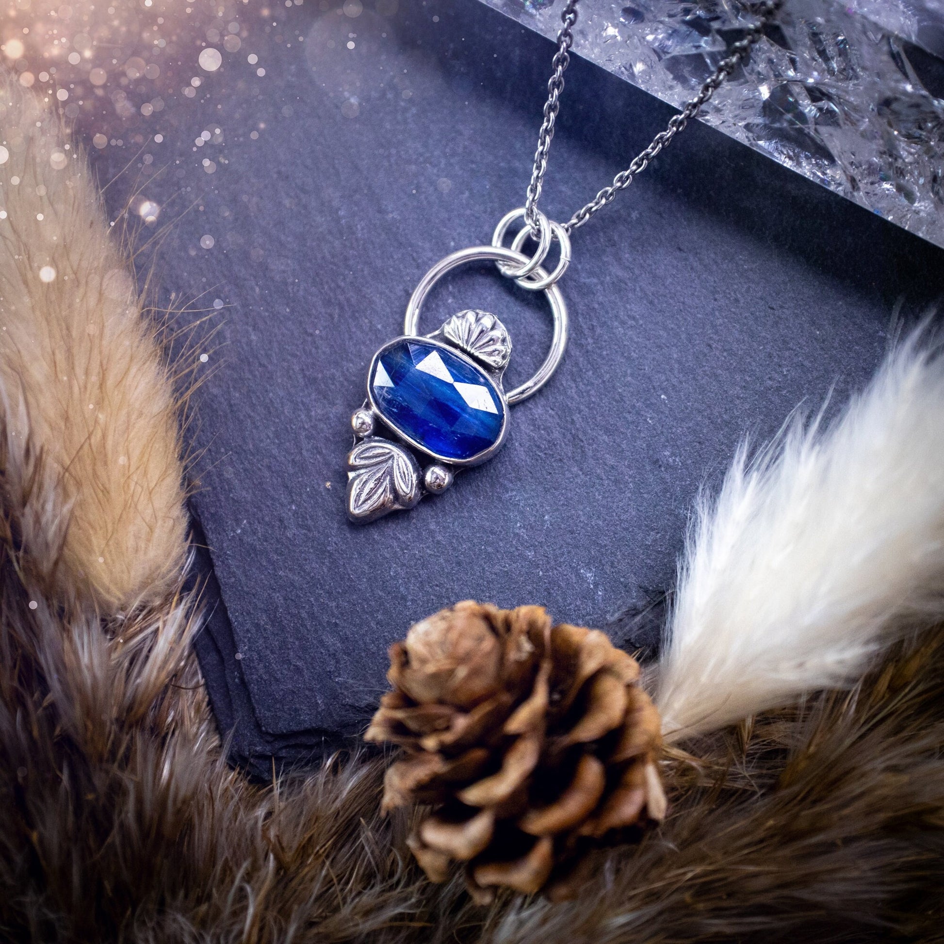 Beautiful, rose cut Blue kyanite sterling silver pendant. This little pendant has been handmade with love and care and has the most stunning colours within the gemstone. Accompanied by silver components including a free chain. Ideal crystal gift.