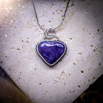 Gorgeous and small, charoite heart crystal, pendant necklace. Made from fine and sterling silver, and featuring a cute little charoite heart! This necklace is handmade and the ideal gift for loved ones, and crystal lovers. Hippy, gothic style.