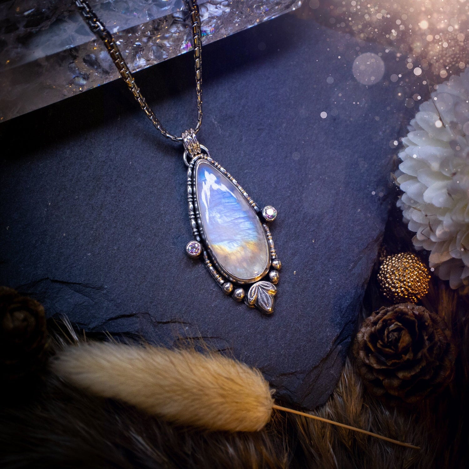 Stunning and handmade, Rainbow moonstone and cubic zirconia pendant necklace. This one of a kind pendant has been made using sterling silver and fine silver, accompanied by leaf components and silver balls. The ideal gift for her. Hippy, gothic