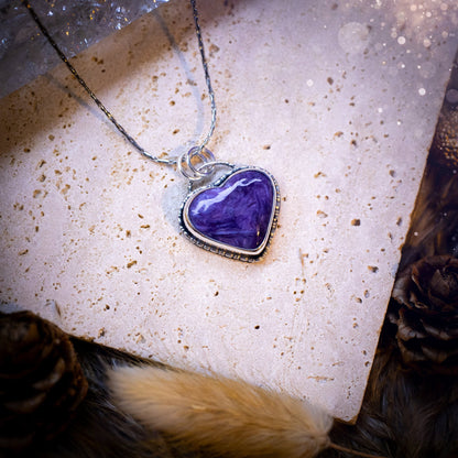 Gorgeous and small, charoite heart crystal, pendant necklace. Made from fine and sterling silver, and featuring a cute little charoite heart! This necklace is handmade and the ideal gift for loved ones, and crystal lovers. Hippy, gothic style.