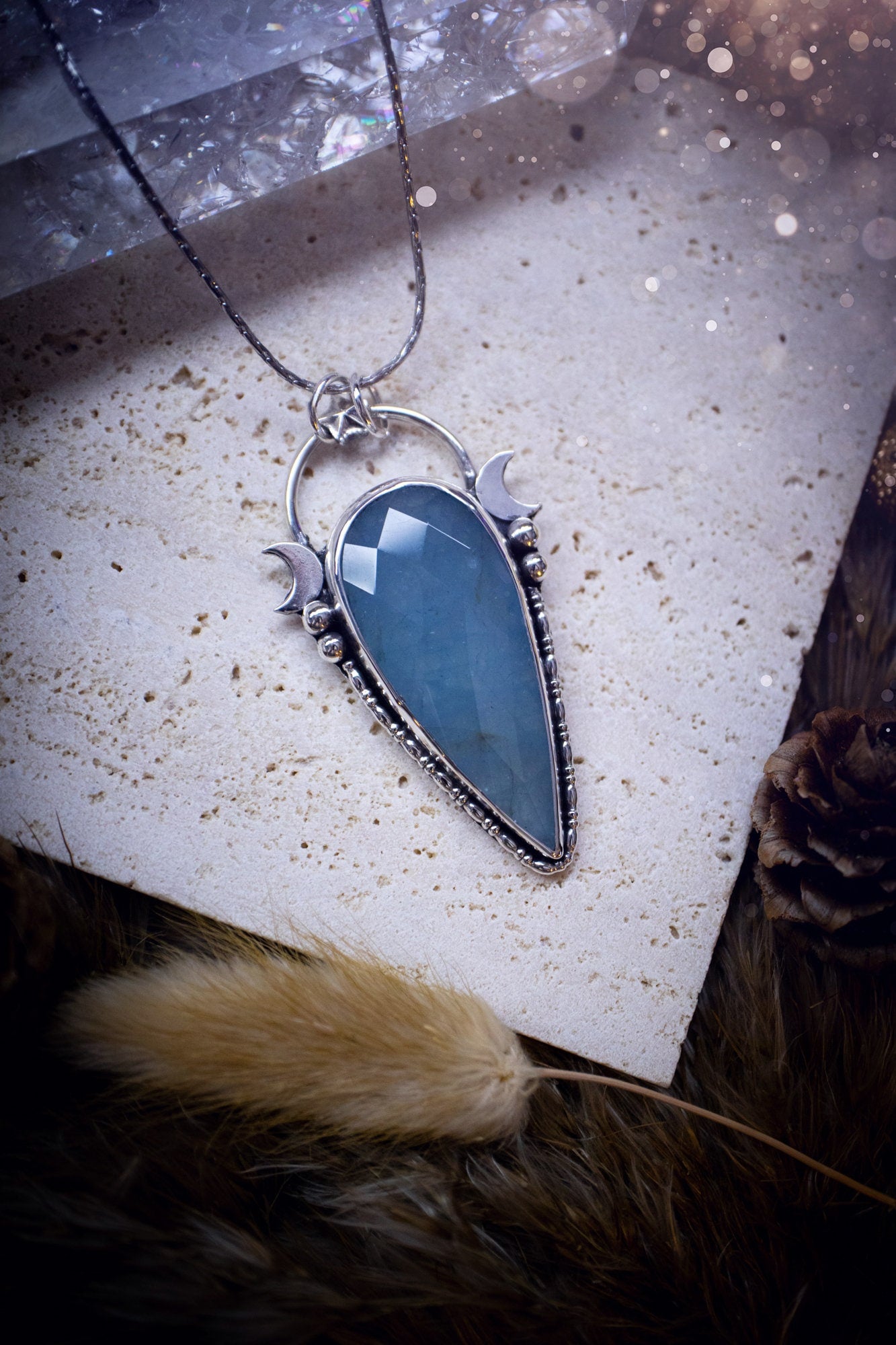 Beautiful and handmade, celestial, natural aquamarine pendant necklace. This pendant has been made using fine and sterling silver and features a gorgeous blue, aquamarine crystal. March birthstone and ideal gift for crystal and jewellery lovers.