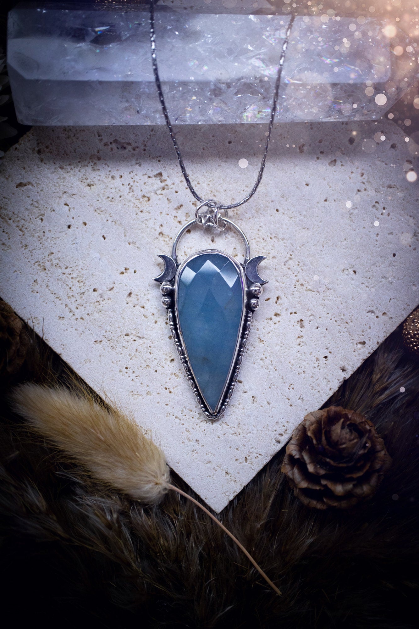 Beautiful and handmade, celestial, natural aquamarine pendant necklace. This pendant has been made using fine and sterling silver and features a gorgeous blue, aquamarine crystal. March birthstone and ideal gift for crystal and jewellery lovers.