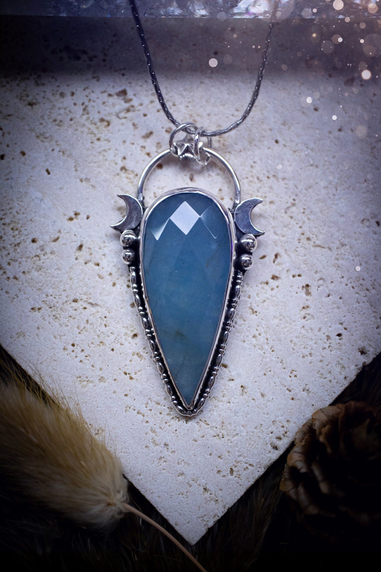 Beautiful and handmade, celestial, natural aquamarine pendant necklace. This pendant has been made using fine and sterling silver and features a gorgeous blue, aquamarine crystal. March birthstone and ideal gift for crystal and jewellery lovers.