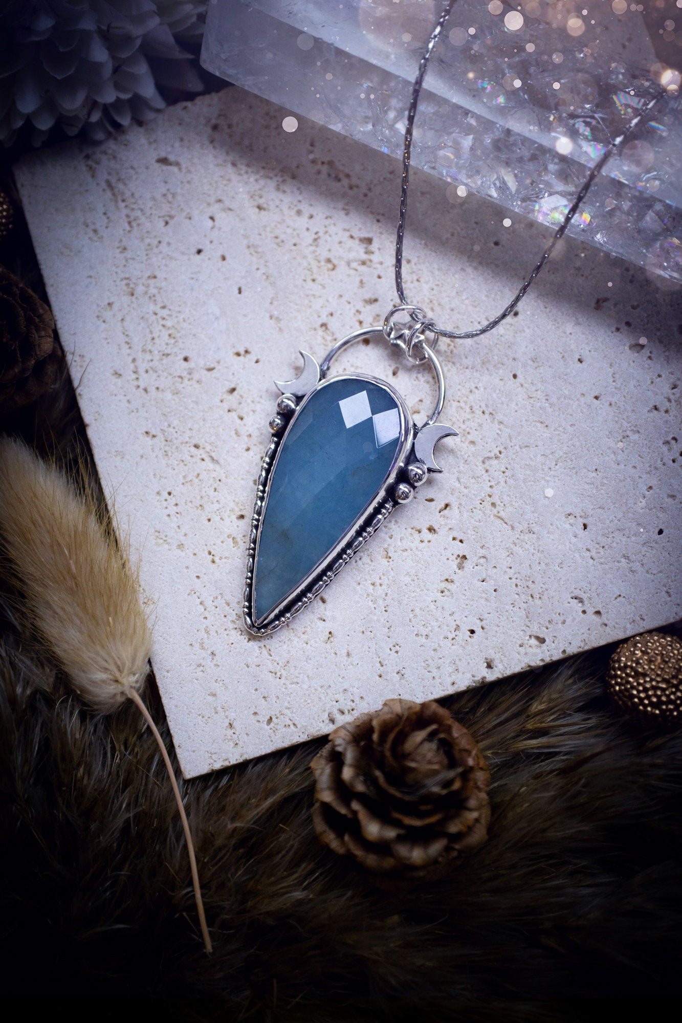 Beautiful and handmade, celestial, natural aquamarine pendant necklace. This pendant has been made using fine and sterling silver and features a gorgeous blue, aquamarine crystal. March birthstone and ideal gift for crystal and jewellery lovers.