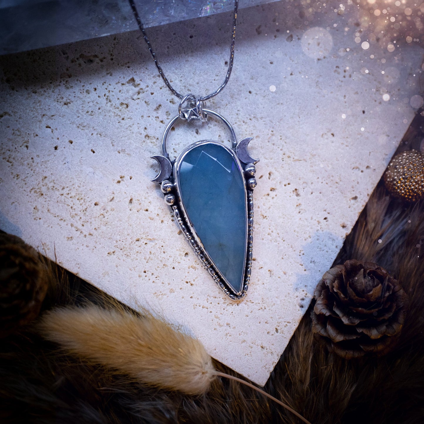 Beautiful and handmade, celestial, natural aquamarine pendant necklace. This pendant has been made using fine and sterling silver and features a gorgeous blue, aquamarine crystal. March birthstone and ideal gift for crystal and jewellery lovers.