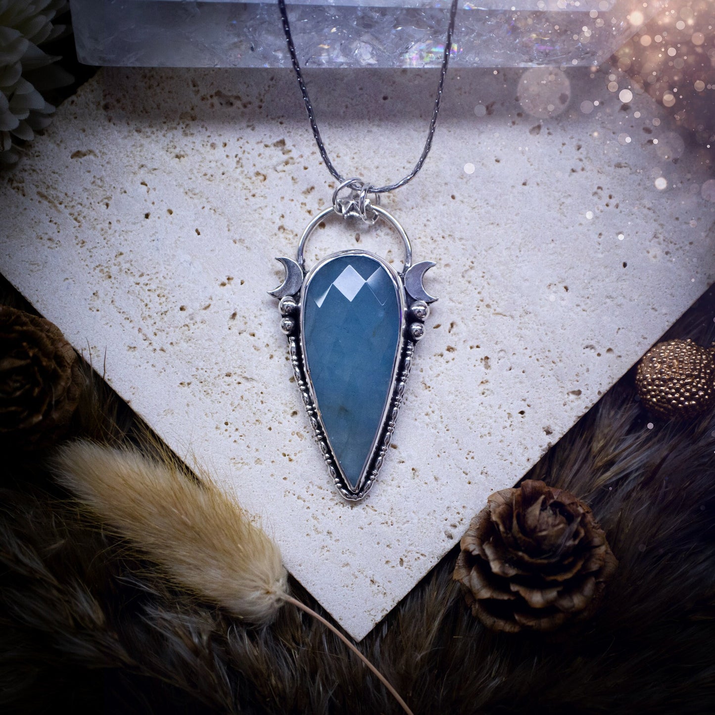 Beautiful and handmade, celestial, natural aquamarine pendant necklace. This pendant has been made using fine and sterling silver and features a gorgeous blue, aquamarine crystal. March birthstone and ideal gift for crystal and jewellery lovers.